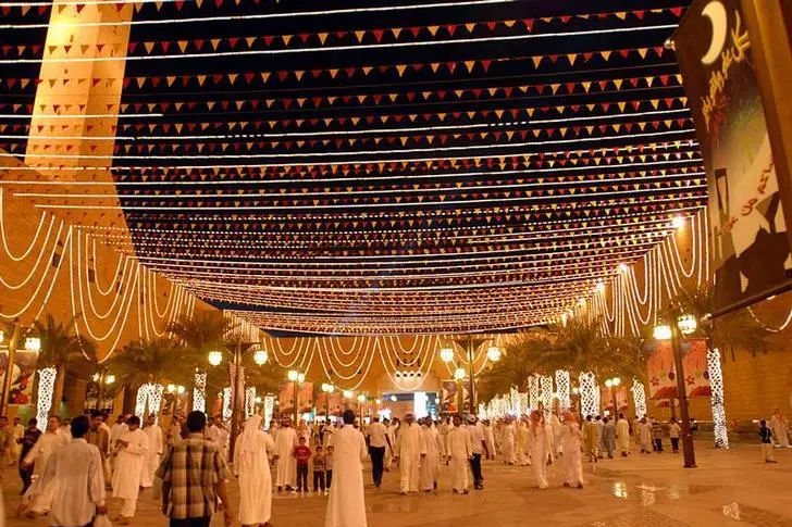 A street decorated with lights and buntings for Eid Al Fitr in Saudi Arabia - (Credits ZAWYA)