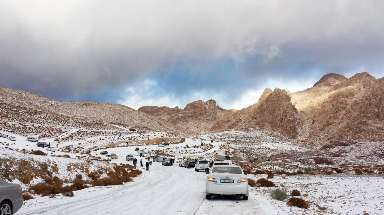 Snow-dusted mountains in Abha with a winding road, showcasing Saudi Arabia’s unique winter beauty - (Credits TechBullion)