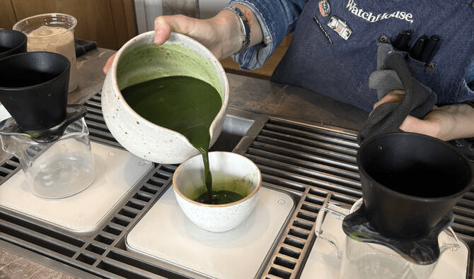 A barista pouring whisked matcha in a bowl - (Credits Arab News)