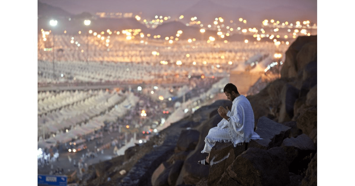 A man sitting on the Mount Arafah making dua - (Credits Muslim Aid)