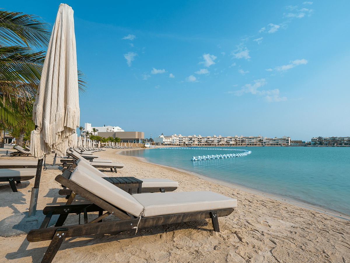 Sunbeds along the sea in a private beach resort in Jeddah - (Credits Shades)